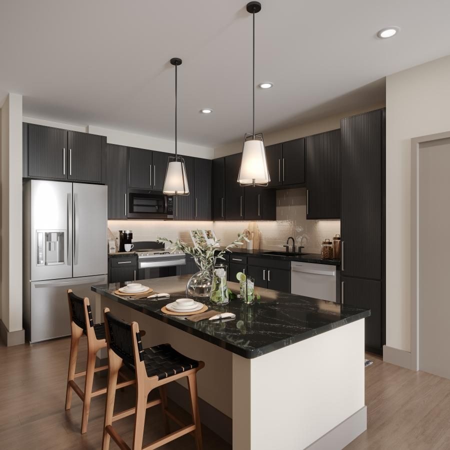 a kitchen with a black island